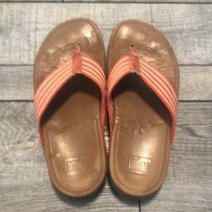 Fitflop unisex in a orange and cream striped color with a heel & wobble board